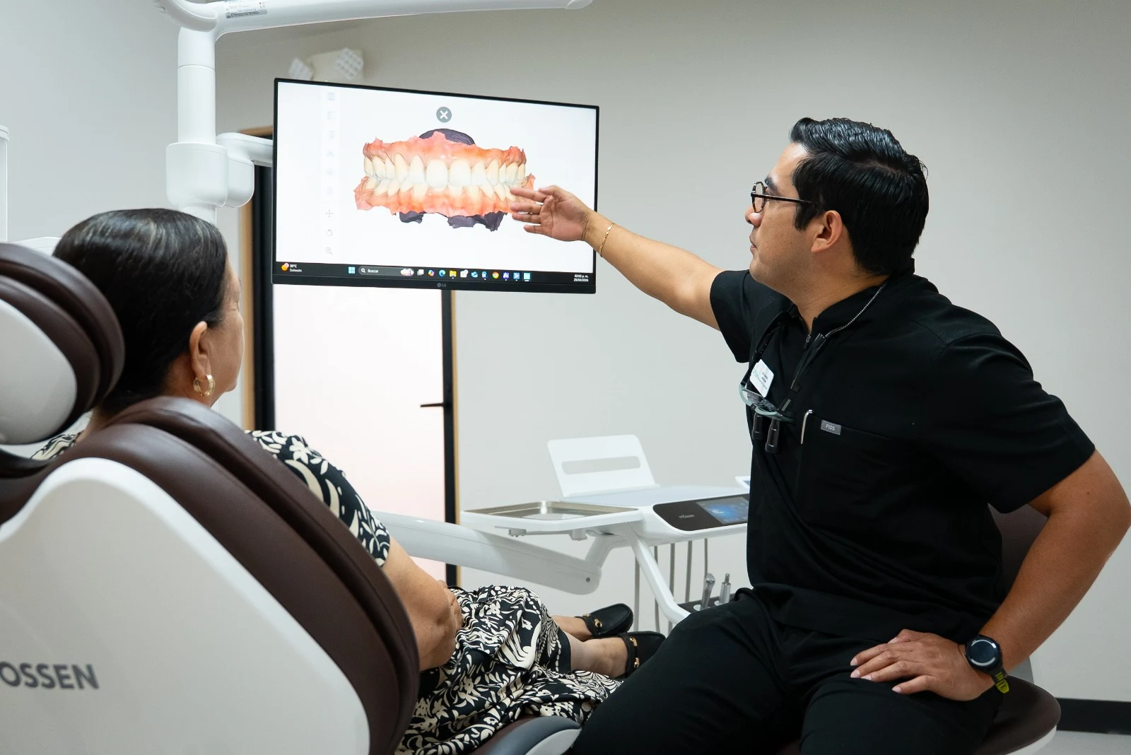 Dentist reviewing an intraoral scan with a patient at Let’s Smile Dentistry
